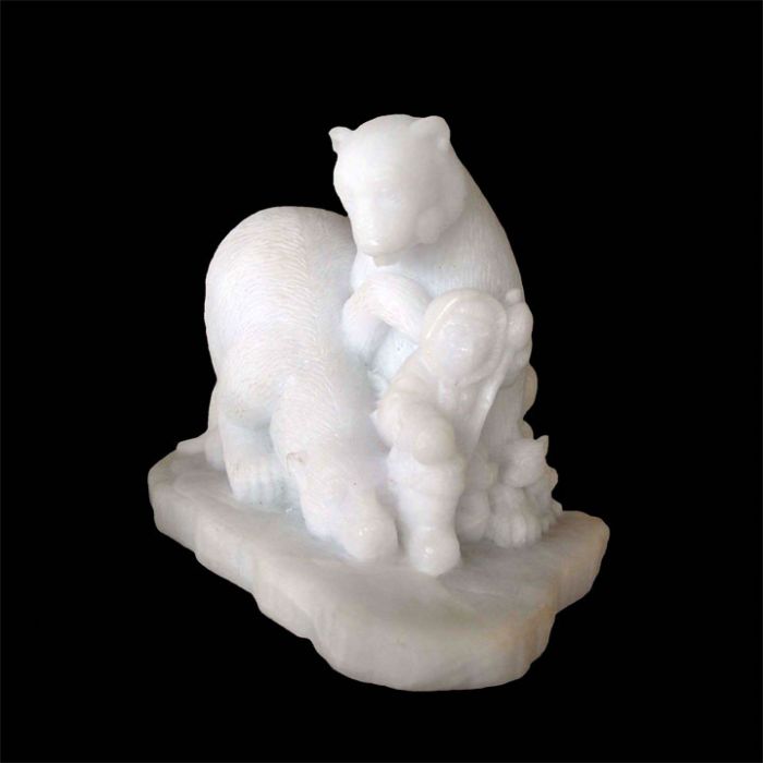 Two Docile Polar Bears led by an Eskimo